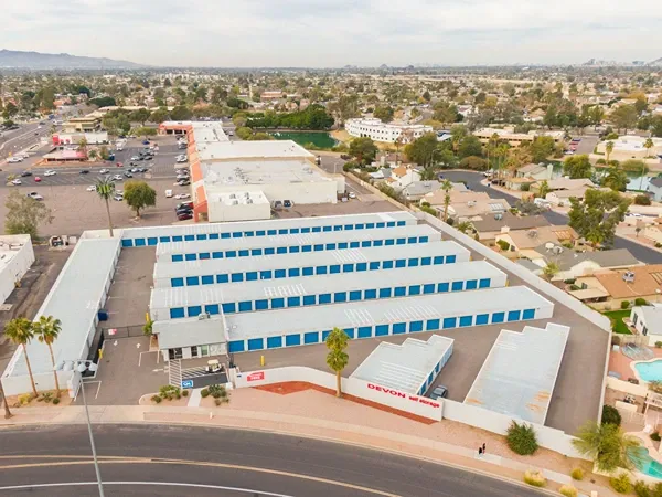 Self storage facility with multiple rows of drive-up units in suburban area